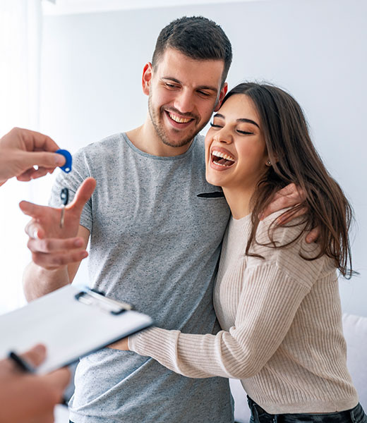Couple Getting Keys to Home